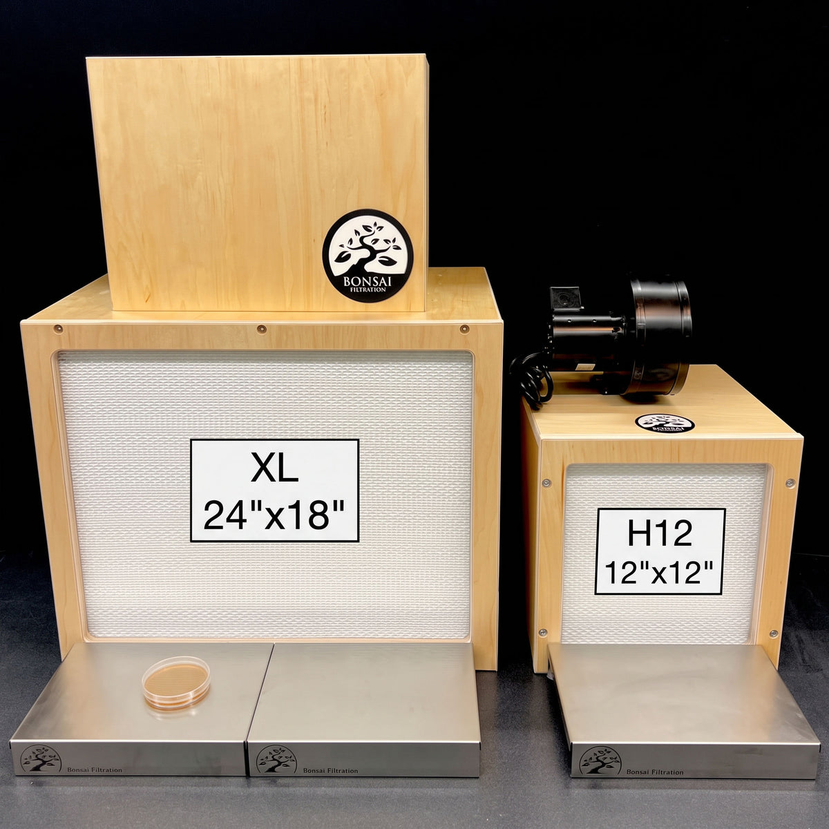 Two wooden Bonsai laminar flow hoods shown on a black background. The larger left unit is labeled XL 24"x18" and the smaller is 12"x12"