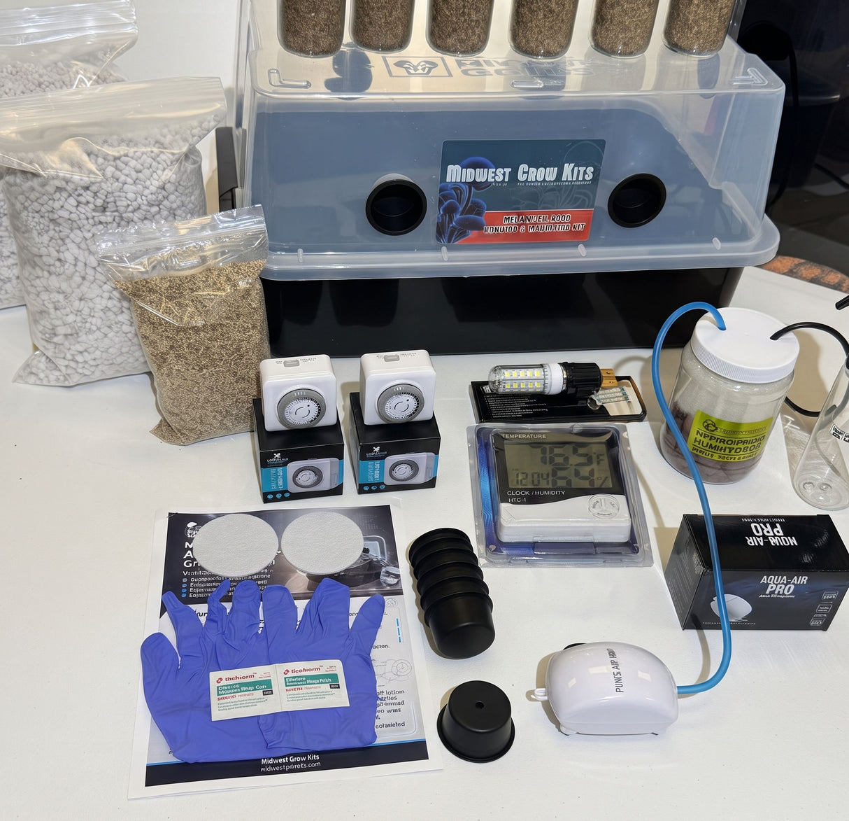Mega kit components including timers, heat mat, LED grow light, air pump and tubing.