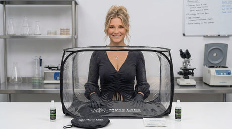 Girl with hands inside a Myco Labs still air box 