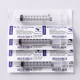 5 10cc luer lock syringes on white background