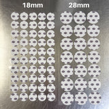 Two sets of round adhesive pads labeled 18mm and 28mm, arranged on a brushed metal surface.