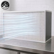 4'x2' White air filter on a metal surface with a white brick wall background