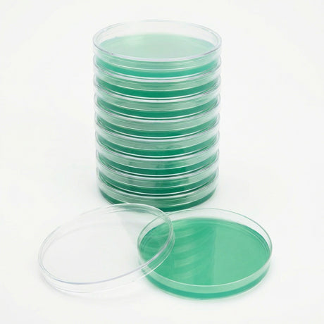 Stack of green agar petri dishes on a white background