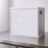 A white and silver Bonsai FFU Flow hood on a stainless steel work surface against a white brick wall background.