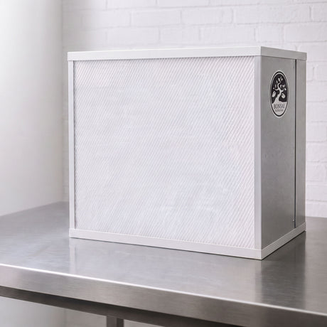 A white and silver Bonsai FFU Flow hood on a stainless steel work surface against a white brick wall background.