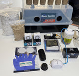 Mega kit components including timers, heat mat, LED grow light, air pump and tubing. 