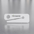 Microppose bag opener with recessed stainless steel blade on a stainless work surface