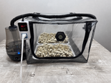 Tabletop Ecosphere fruiting chamber with two substrate trays inside, connected Monsoon humidifier and digital humidity controller