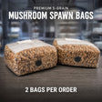 Two sterile 5-Grain spawn bags on a table.