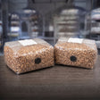 2 sterile bags of organic rye spawn bags on table